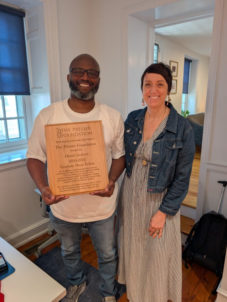 2024-25 Fellow Daniel Jackson receiving his commemorative plaque from Executive Director Teresa Rodgers.
